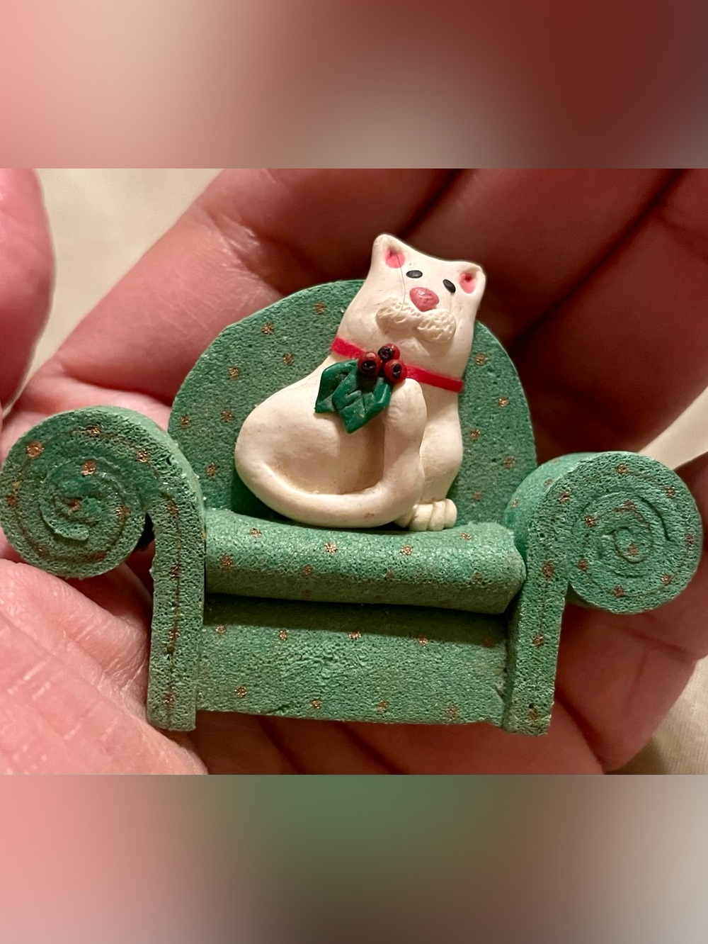 Christmas Cat Figurine on Green Armchair